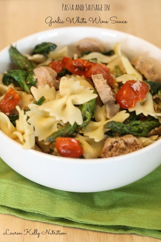 Pasta and Sausage in Garlic White Wine Sauce in a white bowl.