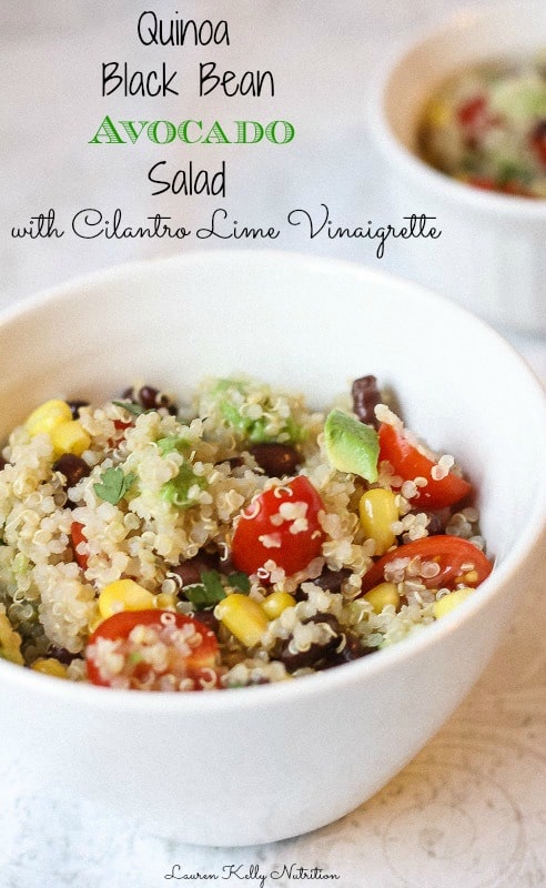 Close up of quinoa black bean salad in a white bowl with the title above it.
