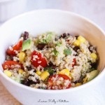 Vertical picture of quinoa salad in a white bowl close up.