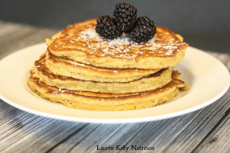 Close up picture of coconut flor pancakes on a white plate.