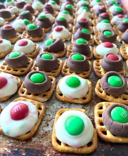 Close up Kisses treats on a baking sheet.