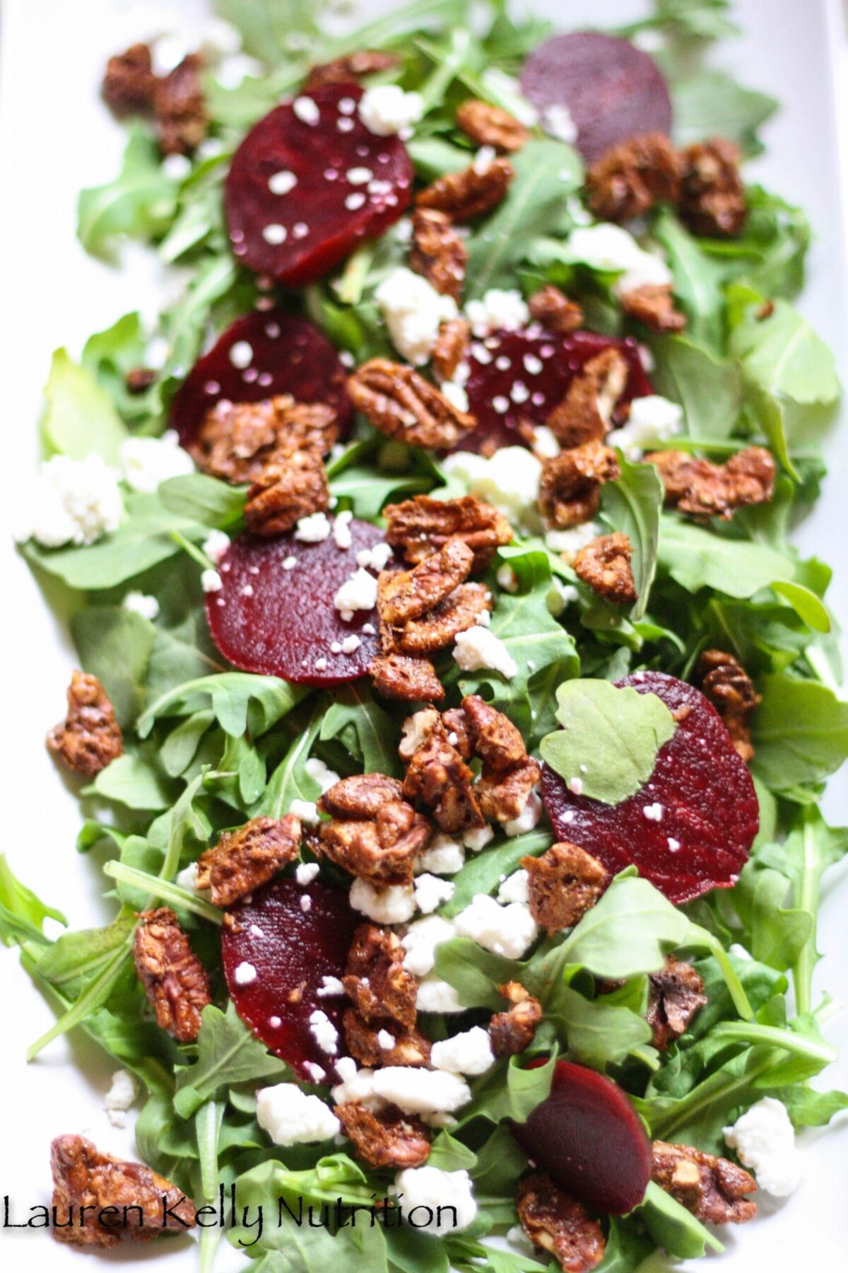 Arugula Beet Salad with Beets Candied Pecans and Gorgonzola Cheese.