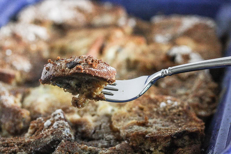 Close up of Overnight French Toast Casserole in a blue baking tray.