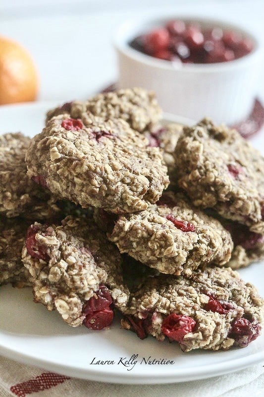 Cranberry Orange Breakfast Cookies piled up in a white plate.