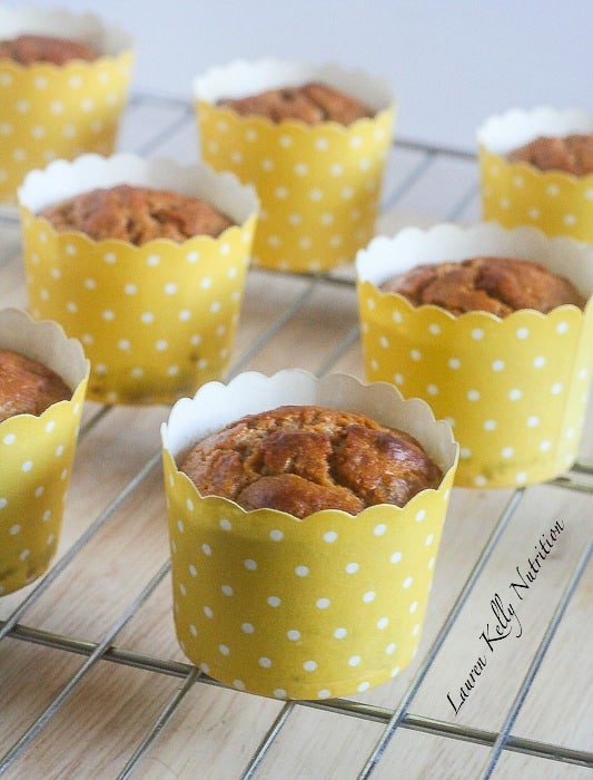 Lemon Chia Seed Muffins on a wire rack in yellow polka dot containers.