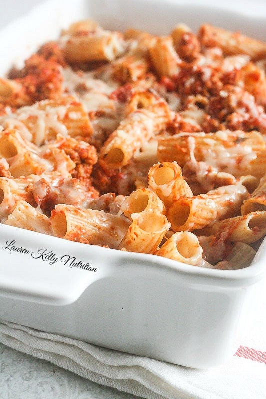 Close up of the Easiest Baked Ziti in a white baking dish.