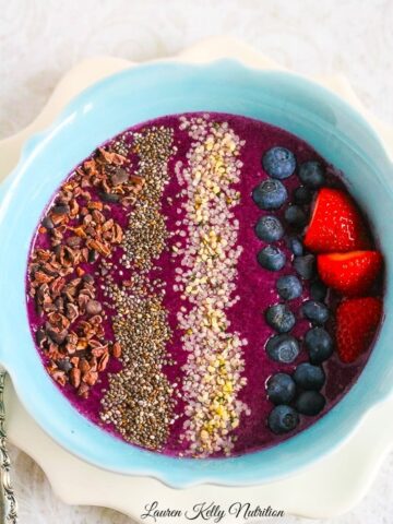 This Healthy Blueberry Mango Smoothie Bowl takes minutes to make and is super delicious! #vegan #dairyfree #protein #glutenfree