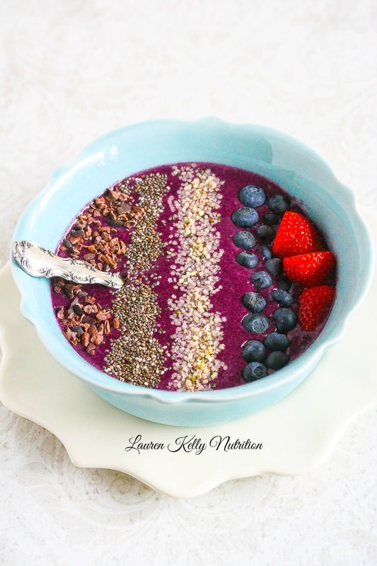 This Healthy Blueberry Mango Smoothie Bowl takes minutes to make and is super delicious! 