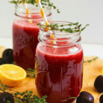 Sparkling black cherry lemonade in mason jars.