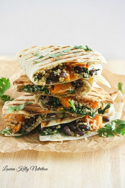 Butternut Squash Black Bean & Quinoa Quesadillas stacked on top of each other.