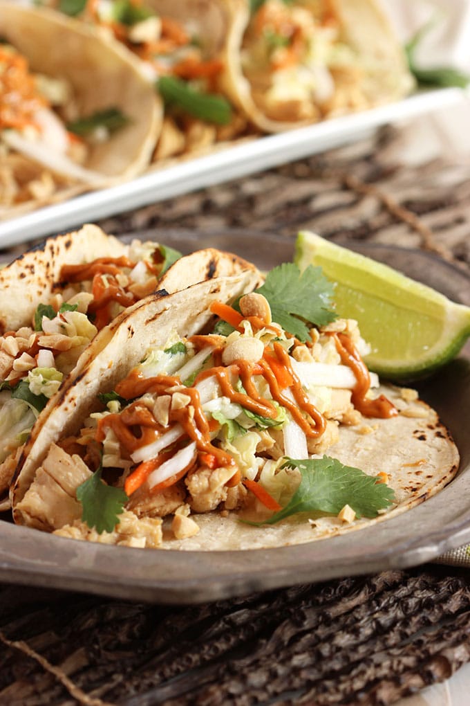 Thai Chicken Tacos with Spicy Peanut Sauce on a plate.