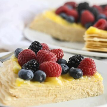 Slice of Buttercream Crepe Cake with Lemon Curd Topping