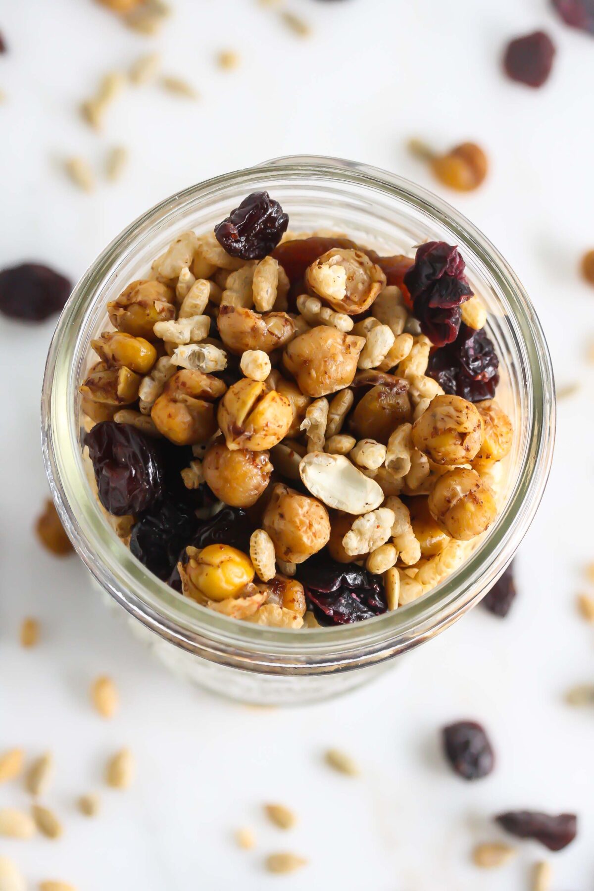 Roasted chickpea trail mix overhead picture in a clear jar.