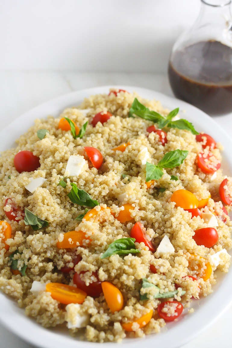 This Caprese Quinoa Salad is simple to make, healthy and delicious. Even carnivores will love this vegetarian salad. www.laurenkellynutrition.com