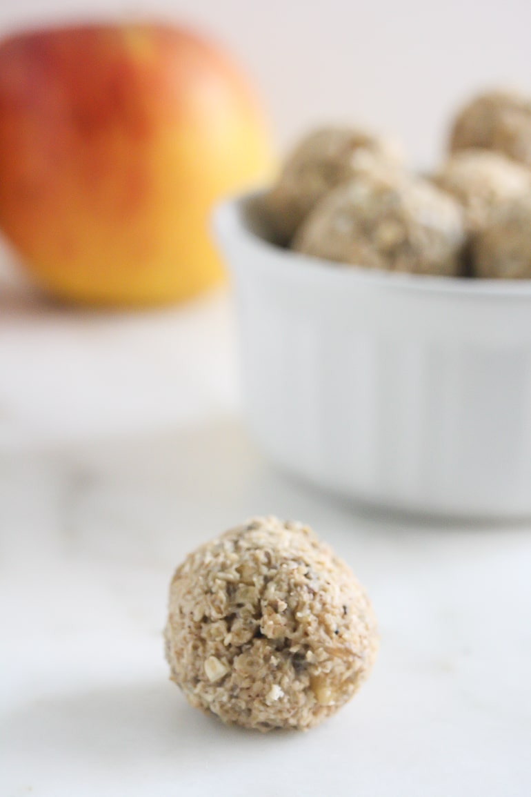 No Bake Apple Pie Bites in a. bowl with one bite in the front.