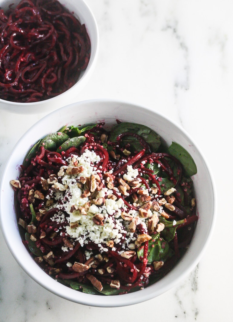 Overhead picture of Spiralized Beet Quinoa Salad in a white bowl.