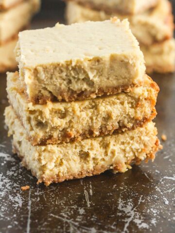 These No Bake Pumpkin Cheesecake Bars are made with your favorite seasonal flavors and are lightened up with Greek yogurt!
