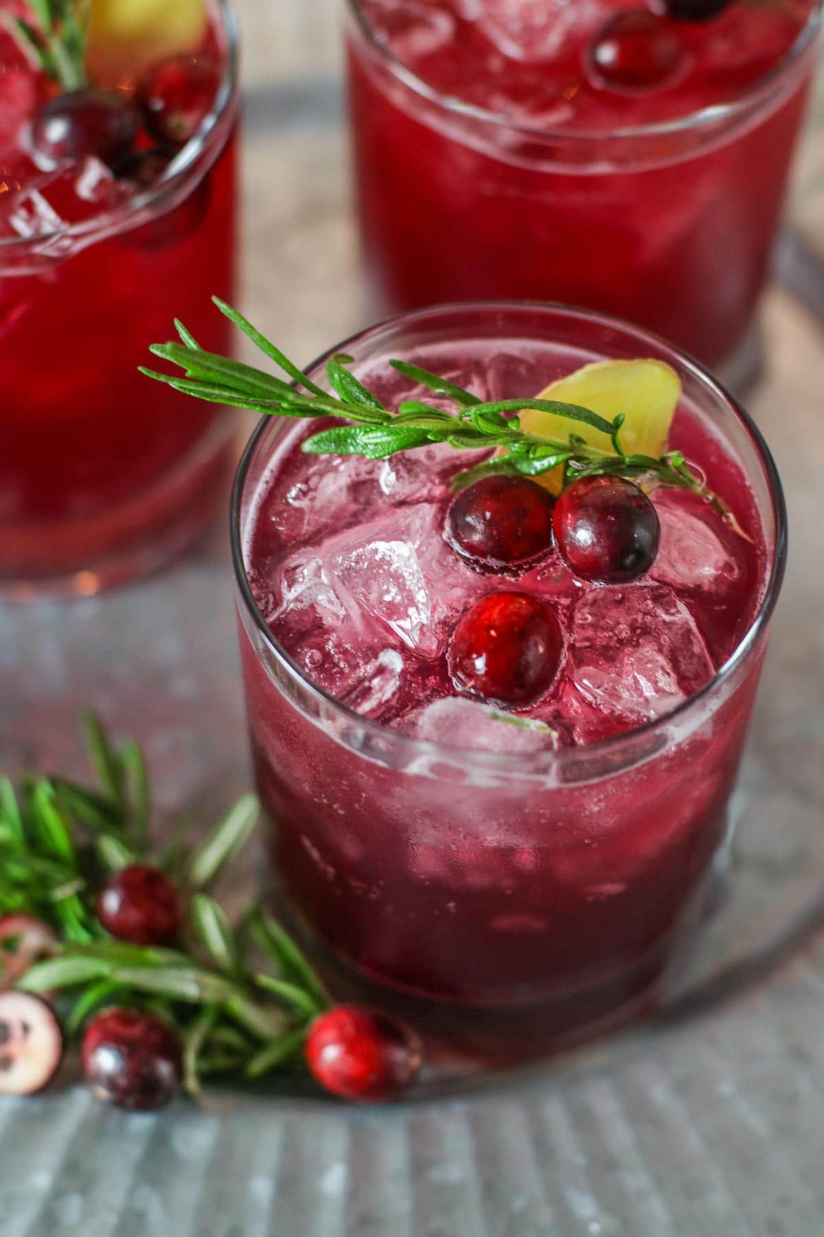 Cranberry kombucha cocktail in a glass.