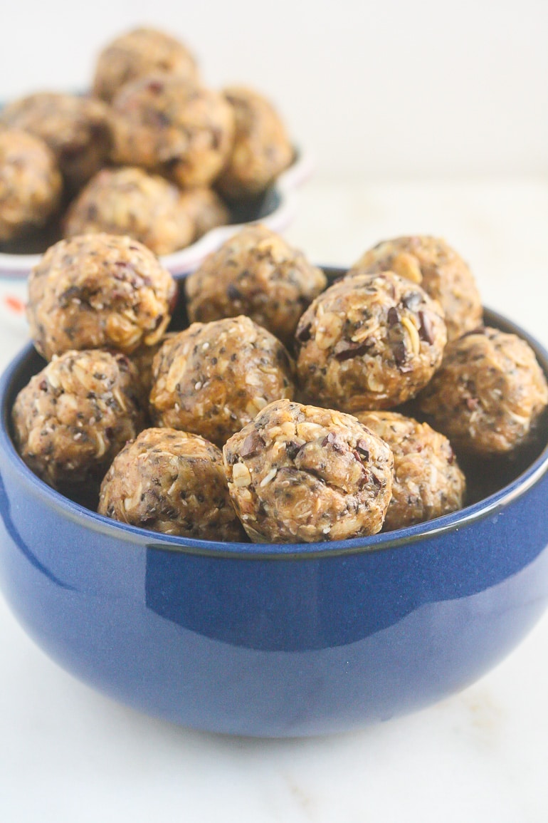 Almond Butter bites in a blue bowl.