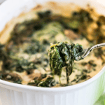 Fork filled with spinach mushroom gratin.
