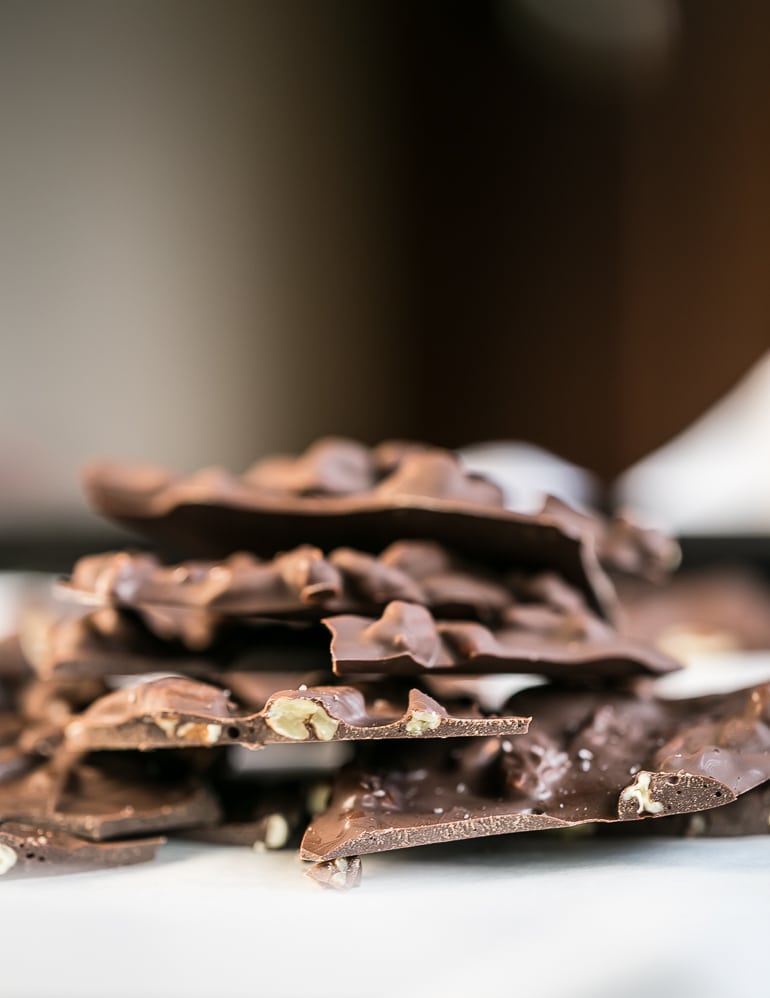 Stack of pieces of Low Carb Keto Salted Pecan Dark Chocolate Bark.