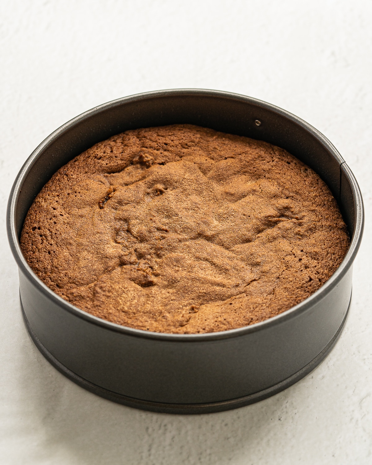 Picture of cooked cake in a cake pan.