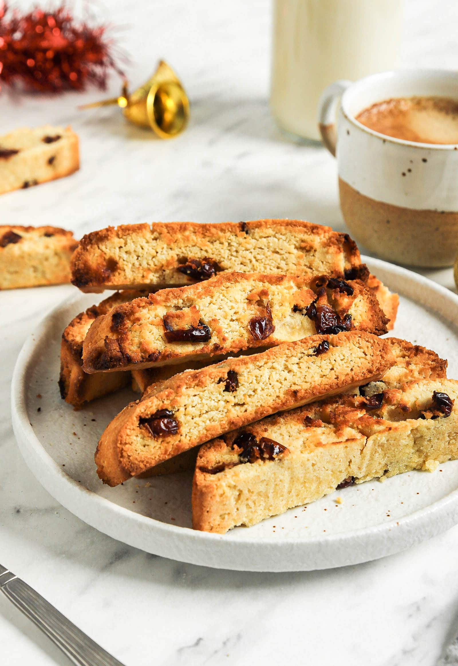 Cranberry biscotti on a white plate.