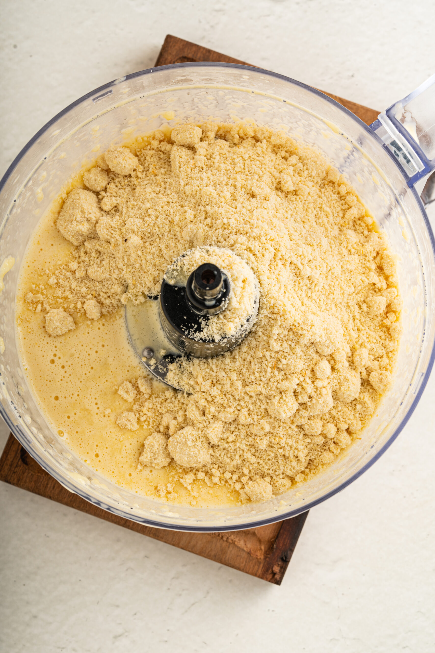 Wet and dry ingredients or low carb rolls in a food processor.