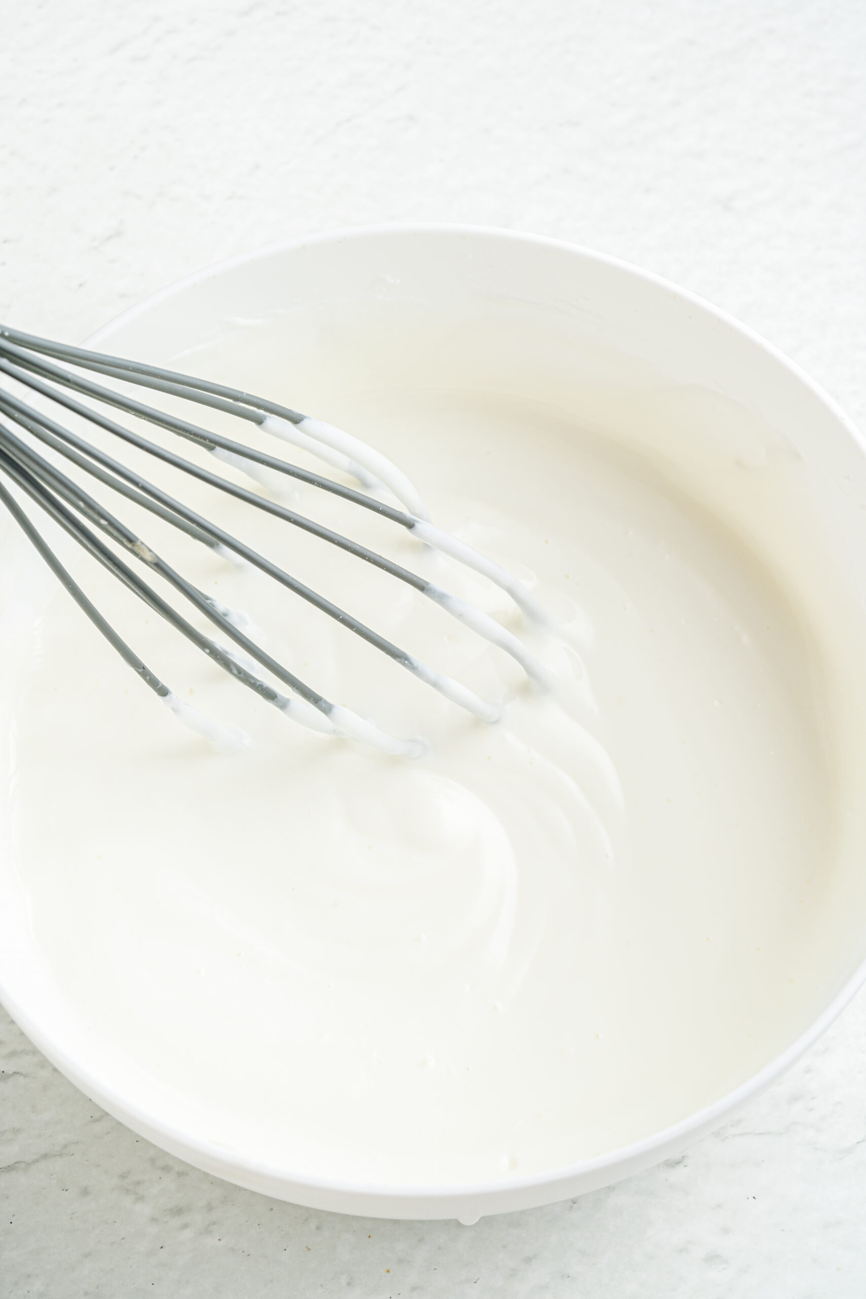Greek yogurt in mixing bowl.