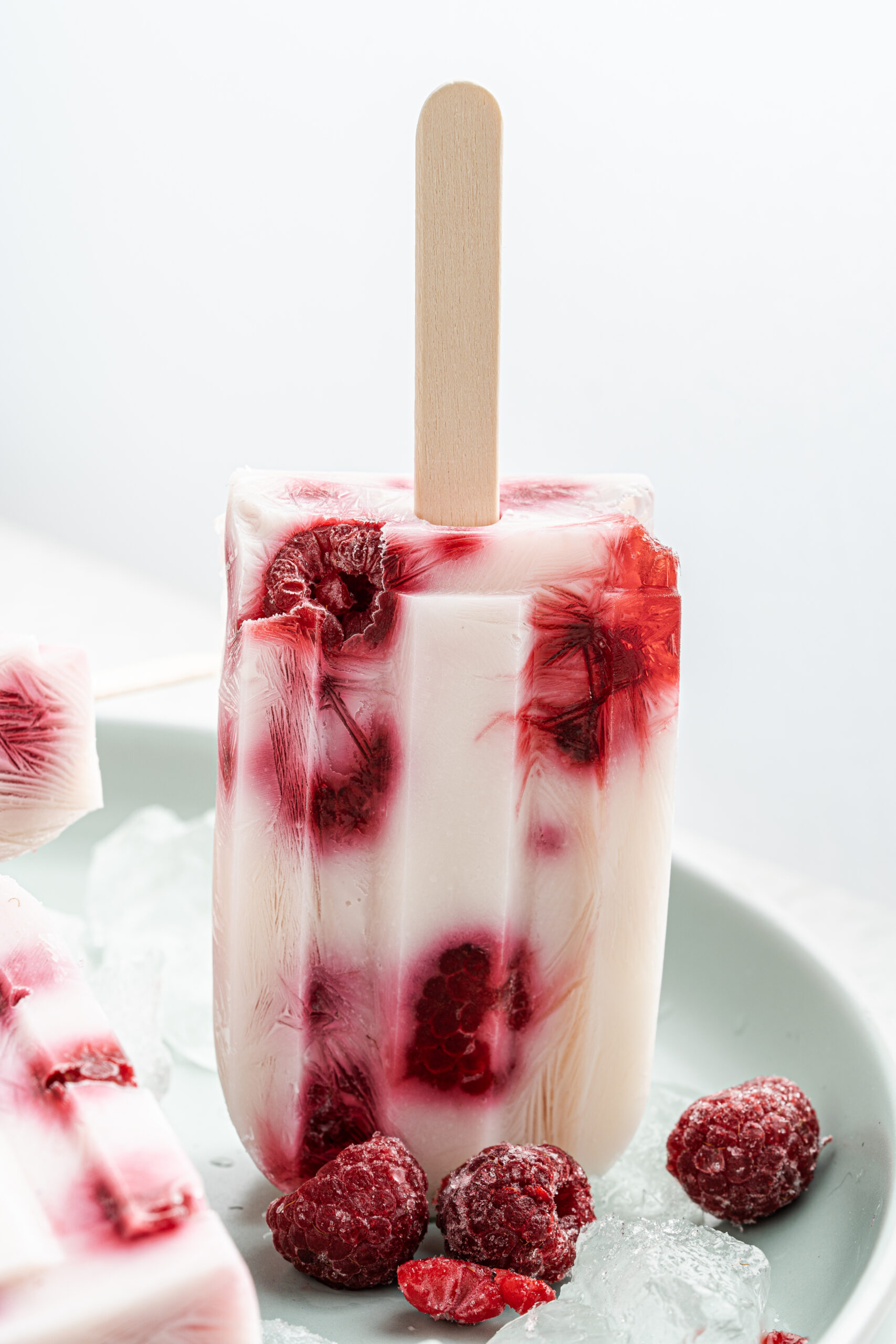 Upside down raspberry yogurt popsicle.