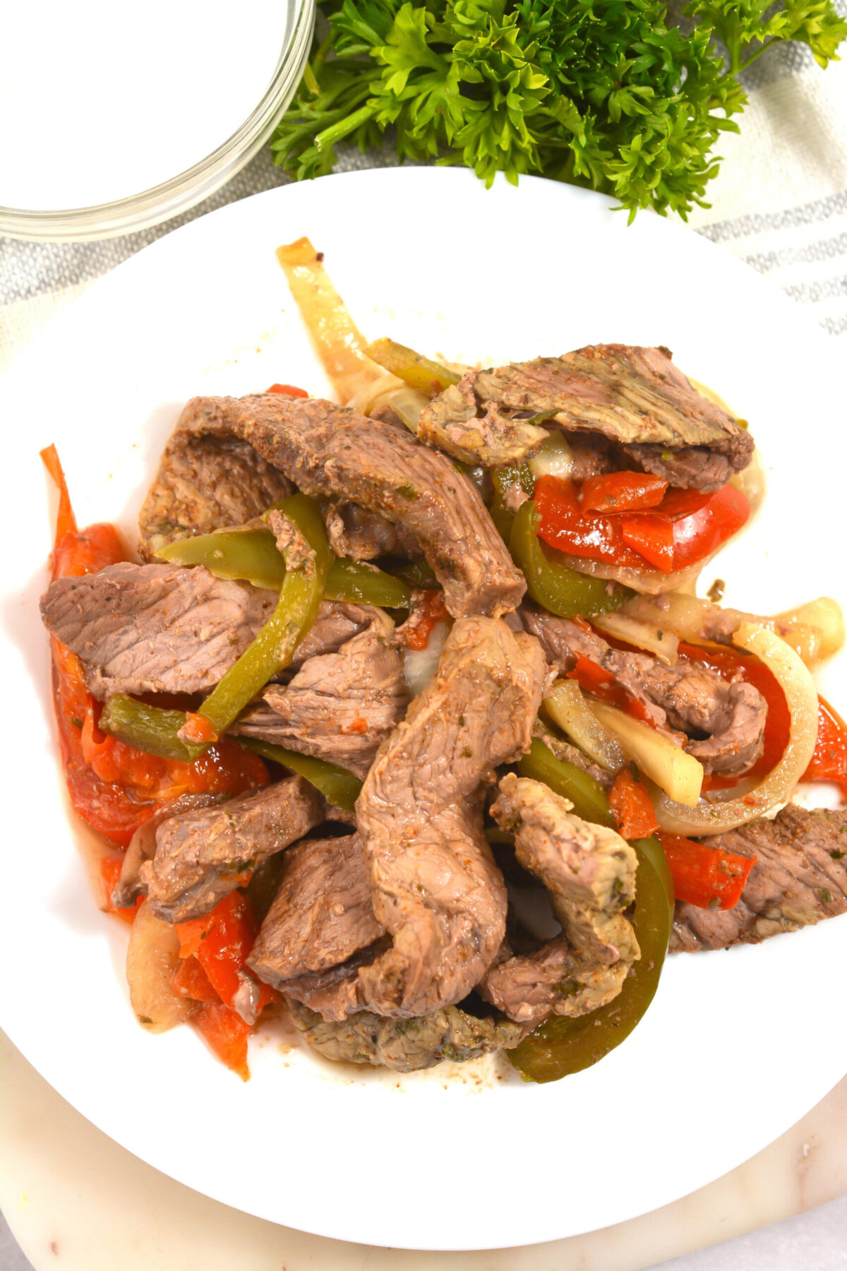 Healthy and loaded with flavor, these Steak Fajitas are easily made in the crock pot! Tender, juicy steak with a delicious fajita seasoning.