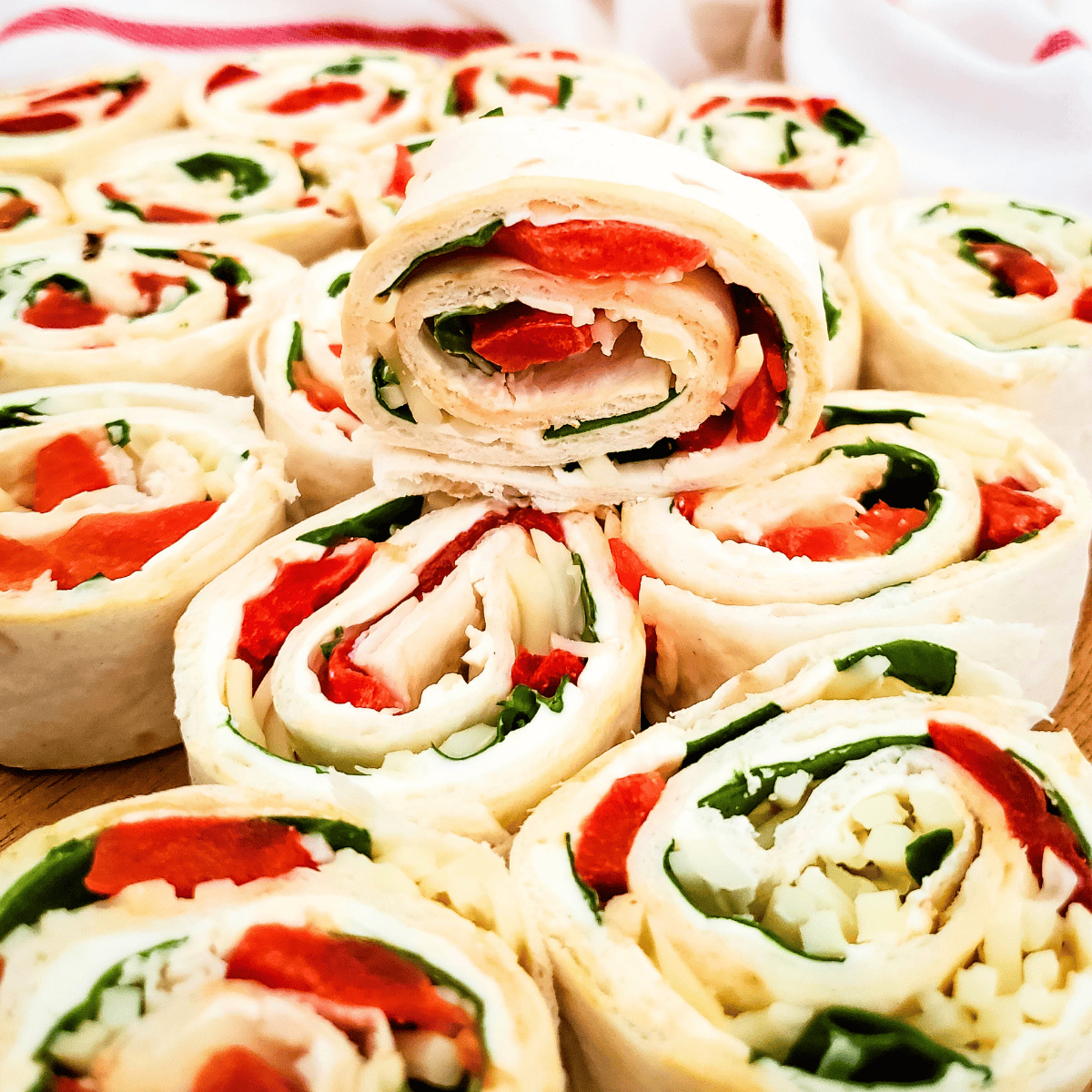Red Pepper Spinach Pinwheels stacked.