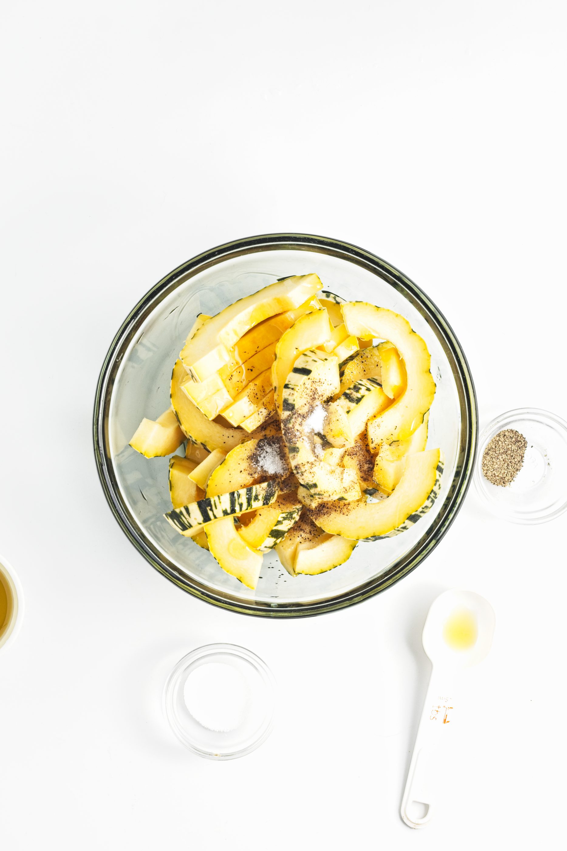 Sliced squash in a glass bowl.