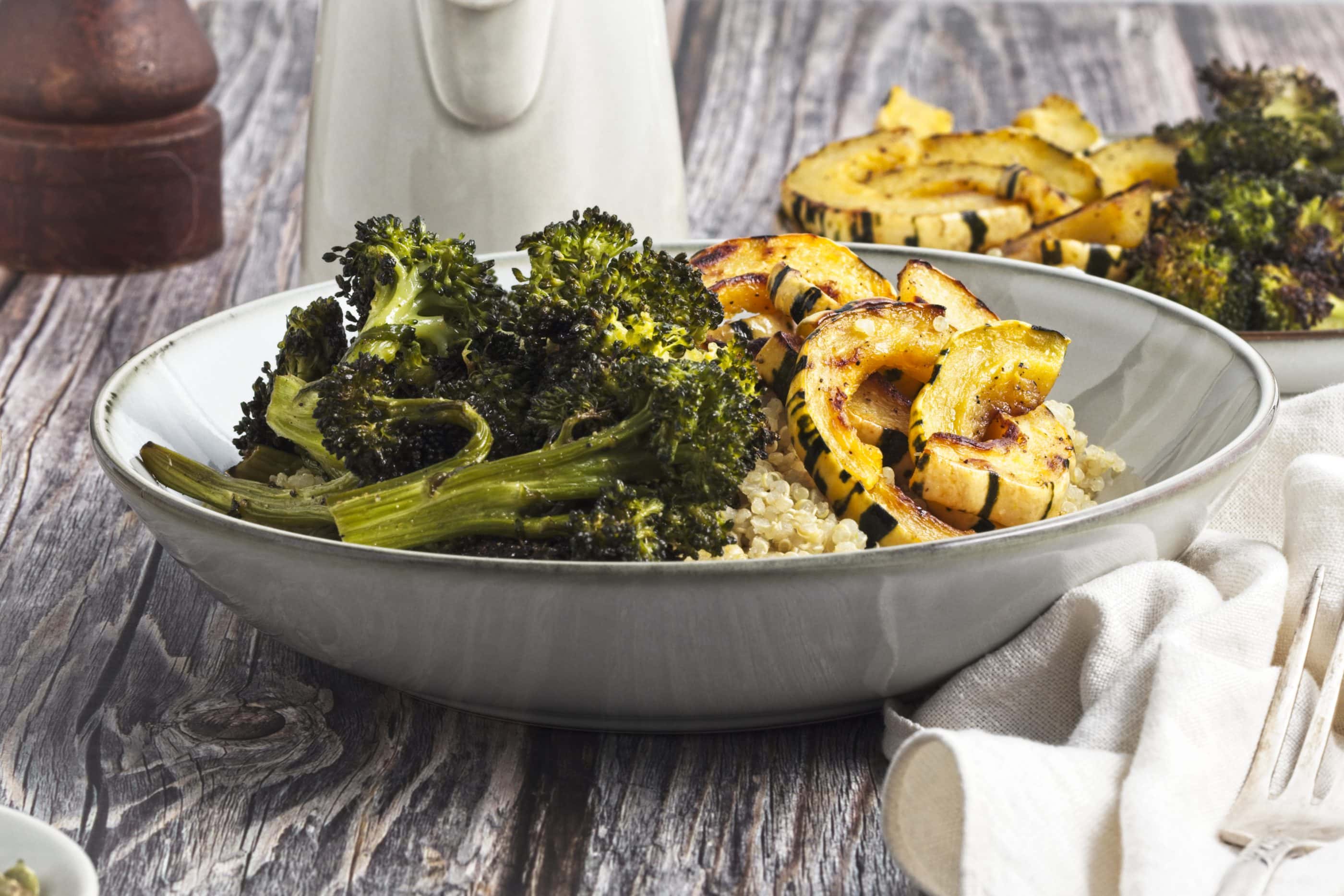 Roasted squash and broccoli in a bowl.